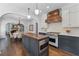 Bright, open kitchen featuring a central island with butcher block countertop and stainless appliances at 1423 Briarcliff Ne Rd, Atlanta, GA 30306