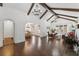 Open living area with hardwood floors, beamed ceilings, and a view into the dining room at 1423 Briarcliff Ne Rd, Atlanta, GA 30306