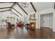 Bright living room featuring vaulted ceilings with wooden beams and a cozy fireplace at 1423 Briarcliff Ne Rd, Atlanta, GA 30306