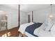 Main bedroom with hardwood floors, ensuite bathroom and four-poster bed with view to the outdoors at 1423 Briarcliff Ne Rd, Atlanta, GA 30306