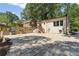 Stone patio with backyard grilling area and stairs up to building at 1423 Briarcliff Ne Rd, Atlanta, GA 30306