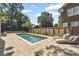 Backyard featuring a private pool, patio, lounge chairs, and lush landscaping at 1423 Briarcliff Ne Rd, Atlanta, GA 30306