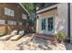 Backyard with outdoor lounge chairs and access to the building through french doors at 1423 Briarcliff Ne Rd, Atlanta, GA 30306