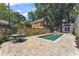 Backyard features a private pool, patio, dining area, and lush landscaping, perfect for entertaining at 1423 Briarcliff Ne Rd, Atlanta, GA 30306