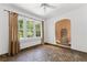Cozy sitting room featuring tiled floors, a large window, and unique water feature at 1423 Briarcliff Ne Rd, Atlanta, GA 30306
