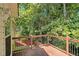 A tranquil backyard deck with a wooded scenery, perfect for outdoor relaxation at 3372 Springside Rdg, Decatur, GA 30034