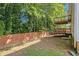 Large backyard featuring a wooden fence and a two-story deck, perfect for outdoor entertaining and relaxation at 3372 Springside Rdg, Decatur, GA 30034