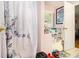 Bright bathroom featuring a floral shower curtain and storage solutions for optimal organization at 3372 Springside Rdg, Decatur, GA 30034