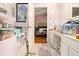 A bathroom with a vanity, storage, and a doorway leading to a bedroom at 3372 Springside Rdg, Decatur, GA 30034