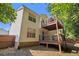Two-story home with a multi-level deck offering outdoor living space, enclosed by a wooden fence at 3372 Springside Rdg, Decatur, GA 30034