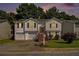 Charming split-level home with a well-maintained lawn, inviting stairs, and an attached two-car garage at 3372 Springside Rdg, Decatur, GA 30034
