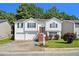 Charming split-level home with a well-maintained lawn, inviting stairs, and an attached two-car garage at 3372 Springside Rdg, Decatur, GA 30034