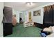 A bright living room with green carpet, plenty of light and a back door at 3372 Springside Rdg, Decatur, GA 30034