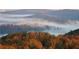 Stunning aerial view of tree-covered mountains shrouded in early morning mist at 49 Waterside Se Dr, Cartersville, GA 30121