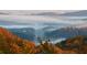 Scenic aerial view of tree-covered mountains and highway shrouded in early morning mist at 49 Waterside Se Dr, Cartersville, GA 30121