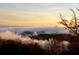Picturesque aerial view of tree-covered mountains shrouded in early morning mist at sunrise at 49 Waterside Se Dr, Cartersville, GA 30121