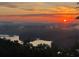 Beautiful sunrise view over lake and mountain, perfect for relaxation and nature lovers at 49 Waterside Se Dr, Cartersville, GA 30121