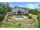 Beautiful backyard with a pool, lush landscaping, and a private outdoor space at 49 Waterside Se Dr, Cartersville, GA 30121