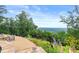 Breathtaking backyard view showcasing an outdoor seating area overlooking the lush landscape at 49 Waterside Se Dr, Cartersville, GA 30121
