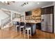 Stylish home bar with ample seating, modern appliances, and a staircase nearby at 49 Waterside Se Dr, Cartersville, GA 30121