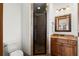 Bathroom features a shower and a vanity with warm-toned cabinets and countertop at 49 Waterside Se Dr, Cartersville, GA 30121