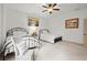 Comfortable bedroom featuring two beds, neutral decor, and a cozy reading chair at 49 Waterside Se Dr, Cartersville, GA 30121