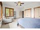 Bright bedroom featuring natural light, ceiling fan and comfortable bed setup at 49 Waterside Se Dr, Cartersville, GA 30121