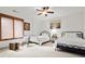 Bright bedroom with two beds, white walls, and a cozy window nook with natural light at 49 Waterside Se Dr, Cartersville, GA 30121
