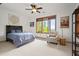 Cozy bedroom with natural light, ceiling fan, and a comfortable bed setup at 49 Waterside Se Dr, Cartersville, GA 30121