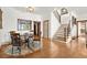 Bright dining room with hardwood floors, staircase, decorative rug and elegant furnishings at 49 Waterside Se Dr, Cartersville, GA 30121