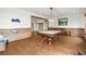 Spacious game room featuring a pool table, wood flooring, and natural wood trim details at 49 Waterside Se Dr, Cartersville, GA 30121