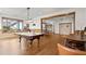 Bright game room featuring pool table, table tennis, and wood flooring at 49 Waterside Se Dr, Cartersville, GA 30121