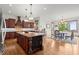 Bright, open kitchen with a center island and an adjacent dining area with large windows at 49 Waterside Se Dr, Cartersville, GA 30121