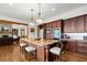 Gourmet kitchen showcasing a granite island with seating and stainless steel appliances at 49 Waterside Se Dr, Cartersville, GA 30121