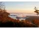 Beautiful lake view from the yard, featuring a scenic view and lush landscaping at 49 Waterside Se Dr, Cartersville, GA 30121
