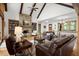 Warm living area featuring hardwood floors, a stone fireplace, and lots of natural light at 49 Waterside Se Dr, Cartersville, GA 30121