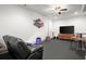 Cozy living room with sleek leather seating and entertainment setup; ideal for movie nights at 49 Waterside Se Dr, Cartersville, GA 30121