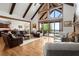 Open-concept living area with hardwood floors, large windows, and a comfortable seating arrangement at 49 Waterside Se Dr, Cartersville, GA 30121