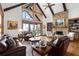 Spacious living room featuring a stone fireplace, vaulted ceiling, and comfortable seating at 49 Waterside Se Dr, Cartersville, GA 30121