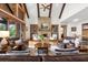 Comfortable living room with stone fireplace, built-in shelving, and access to an outdoor view at 49 Waterside Se Dr, Cartersville, GA 30121