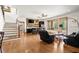 Open-concept living room showcasing bar area, hardwood floors, comfortable seating, and seamless indoor-outdoor flow at 49 Waterside Se Dr, Cartersville, GA 30121