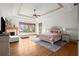 Spacious main bedroom boasts a tray ceiling, fireplace, and scenic views at 49 Waterside Se Dr, Cartersville, GA 30121