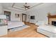 Spacious main bedroom boasts a tray ceiling, fireplace, and scenic views at 49 Waterside Se Dr, Cartersville, GA 30121