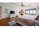 Spacious main bedroom boasts a tray ceiling, fireplace, and scenic views at 49 Waterside Se Dr, Cartersville, GA 30121