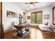Bright home office features hardwood floors, natural light and a desk at 49 Waterside Se Dr, Cartersville, GA 30121