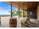 Covered patio featuring wood accents, outdoor seating, and a picturesque view at 49 Waterside Se Dr, Cartersville, GA 30121