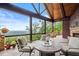 Comfortable outdoor patio with a stone fireplace and stunning mountain views at 49 Waterside Se Dr, Cartersville, GA 30121