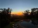 Inviting pool area with scenic sunrise view overlooking mountains and natural surroundings at 49 Waterside Se Dr, Cartersville, GA 30121