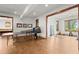 Spacious recreation room featuring a ping pong table, hardwood flooring, and windows that provide natural light at 49 Waterside Se Dr, Cartersville, GA 30121