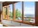A stunning view from a large bedroom window overlooks lush greenery at 49 Waterside Se Dr, Cartersville, GA 30121